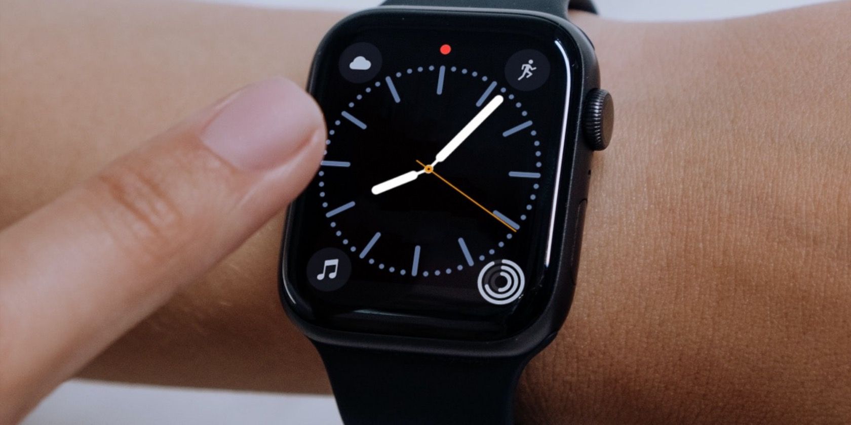 Apple Watch face with a red dot.