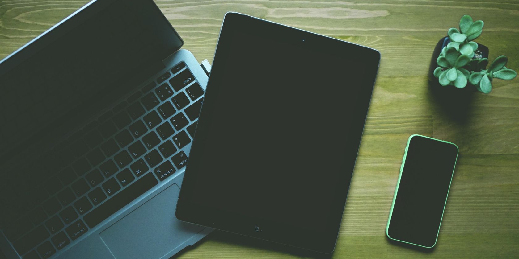 MacBook alongside an iPhone and iPad.