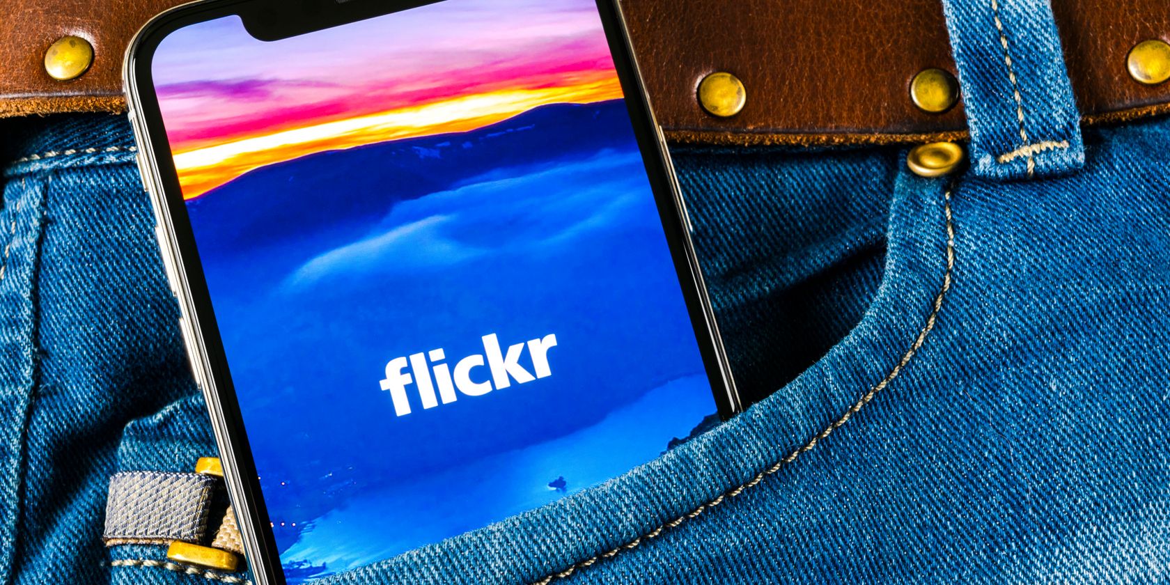 flickr logo on phone in jean pocket