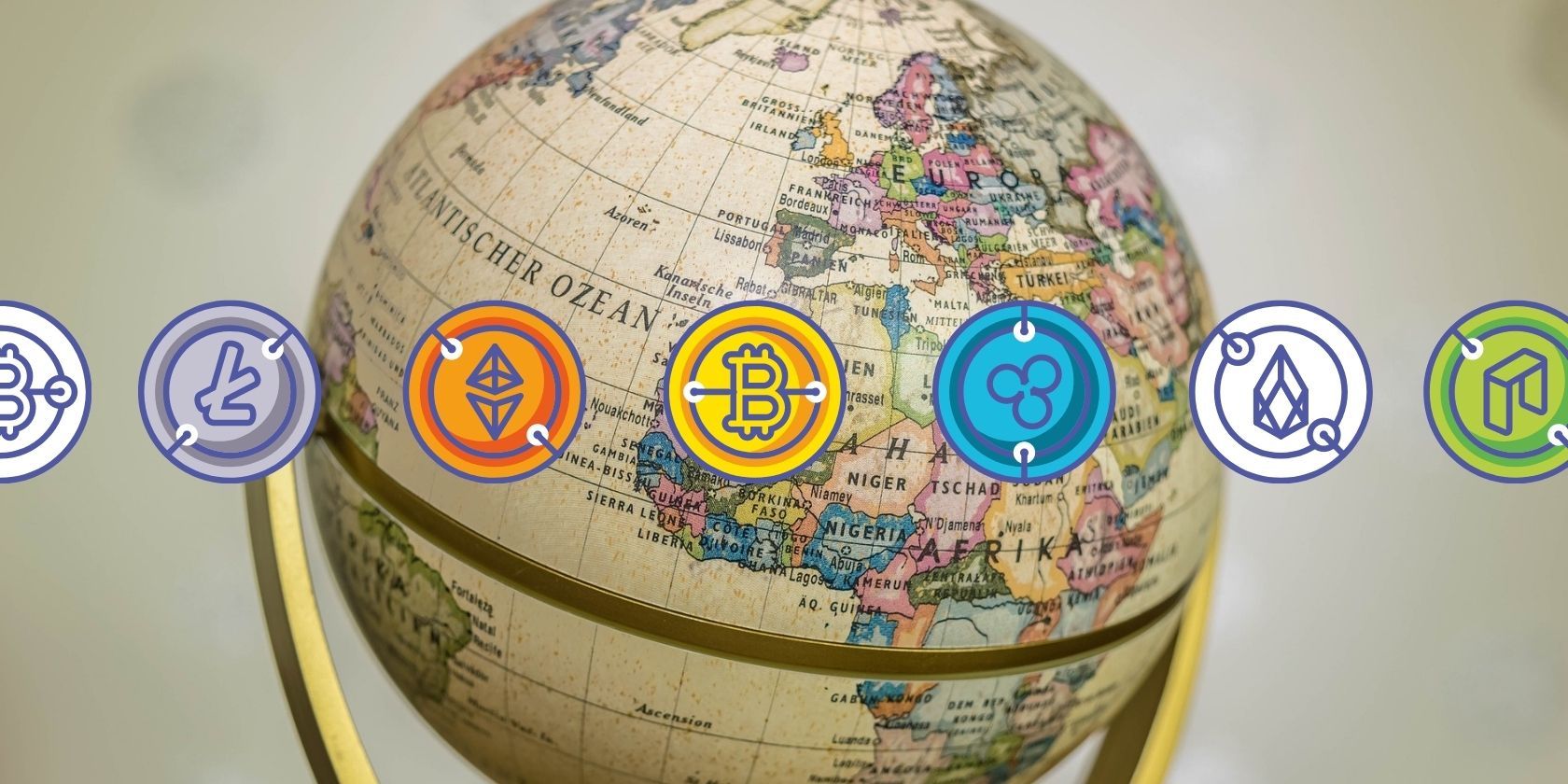 vintage globe behind crypto logos
