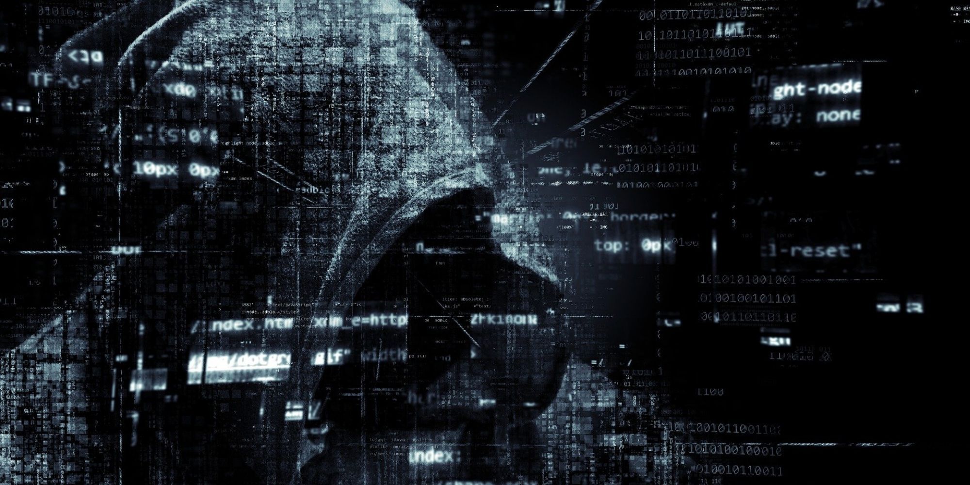 A hacker wearing a hoodie surrounded by visible data.