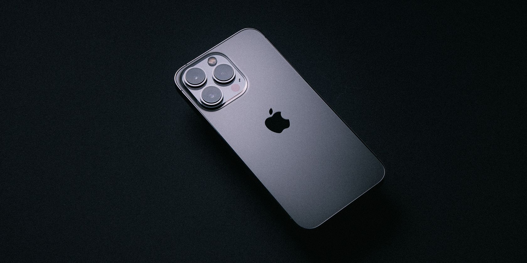 iPhone 13 Pro on dark background