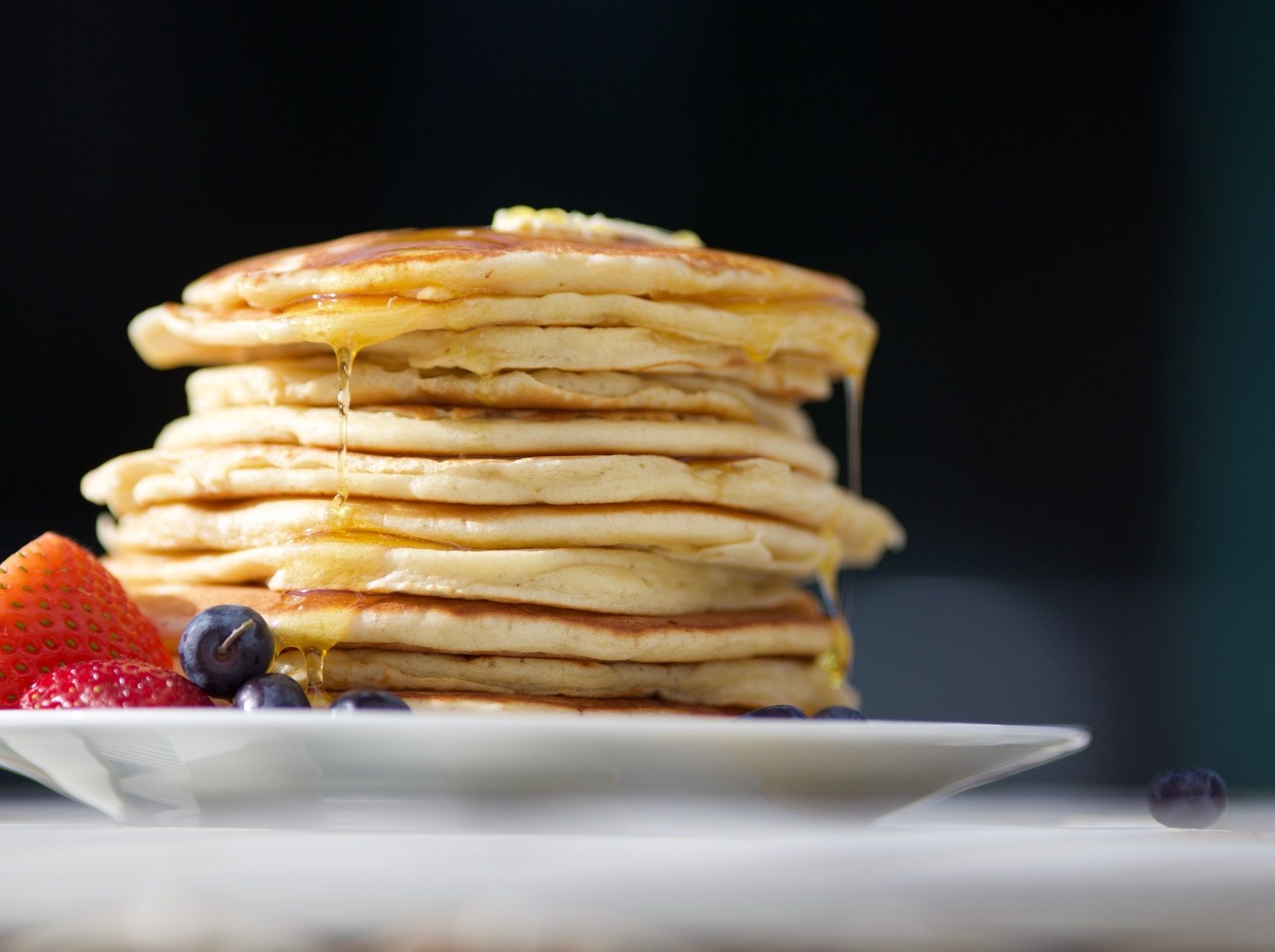 A stack of pancakes taken from a low-angle to show the layers