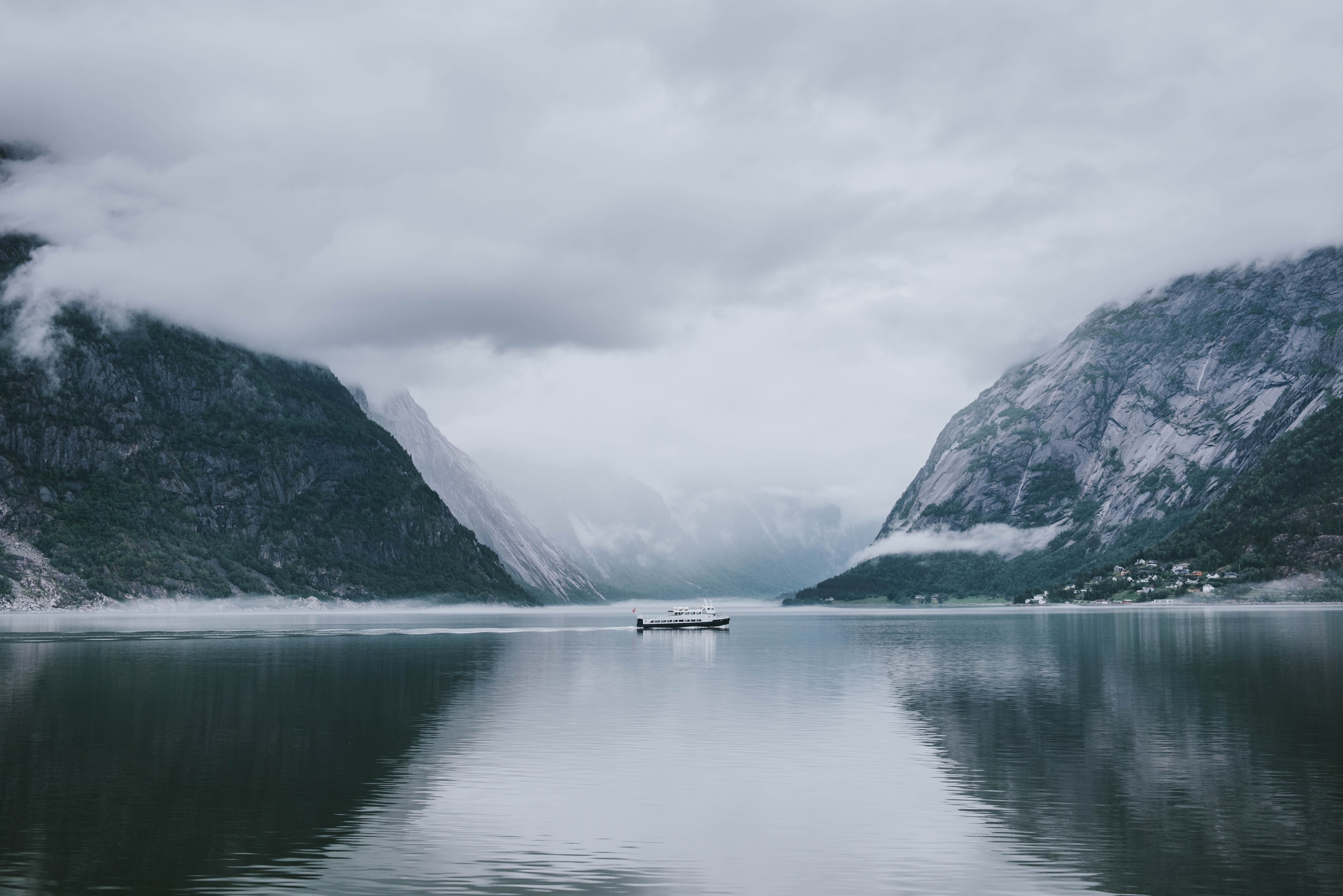 photo of a moody fjord and mountain landscape