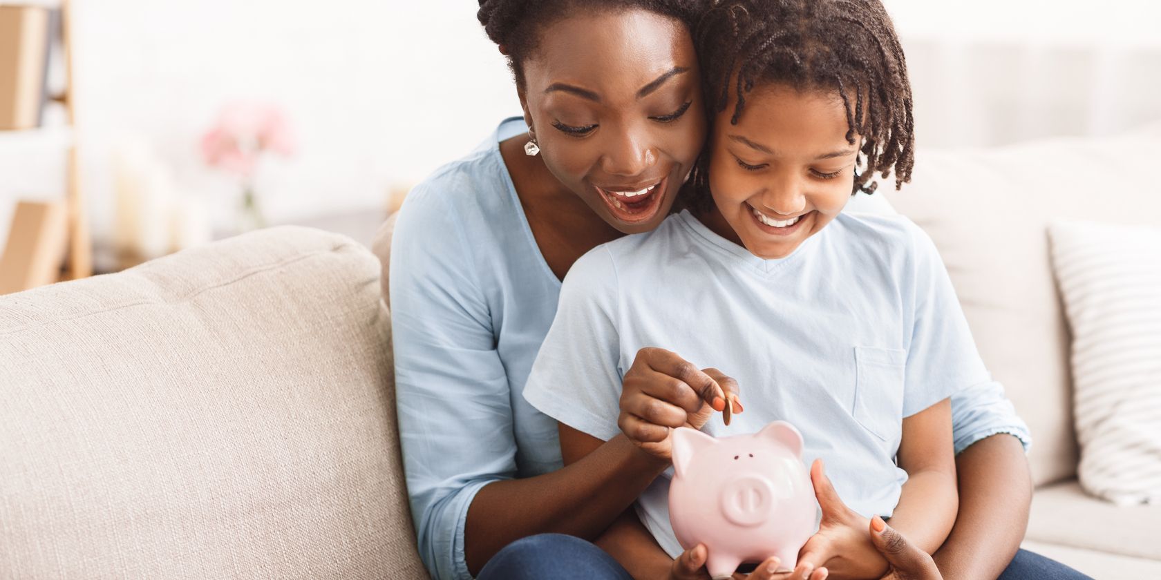 mother and child putting money in pig