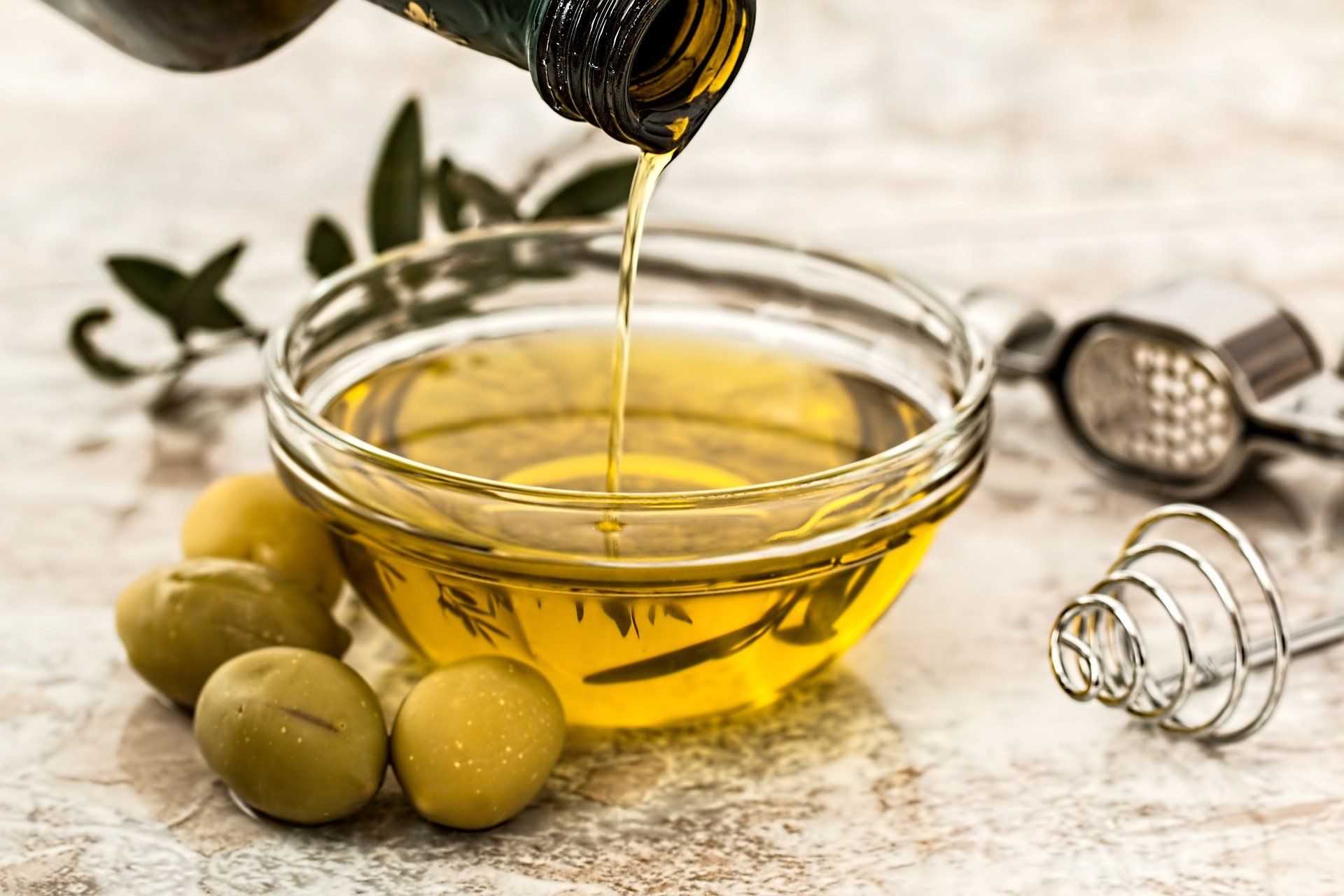 A bowl with olive oil in it