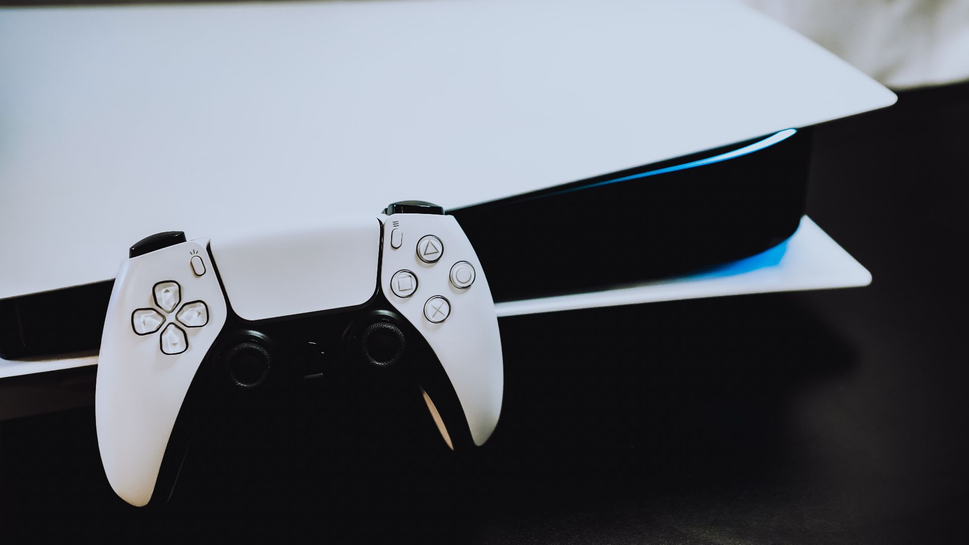 white playstation 5 ps5 controller and console