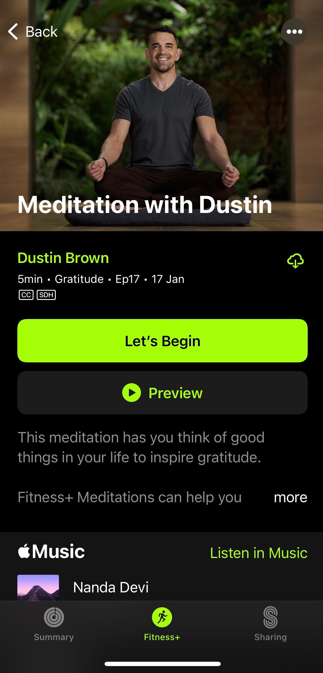 Screenshot from Apple Fitness+ app showing a man sitting cross-legged with the caption Meditation with Dustin