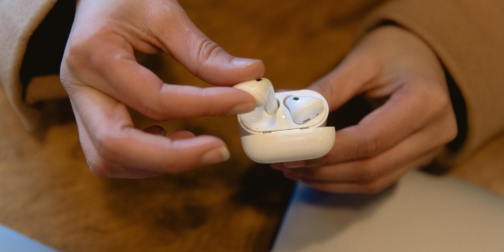 Person Holding AirPods