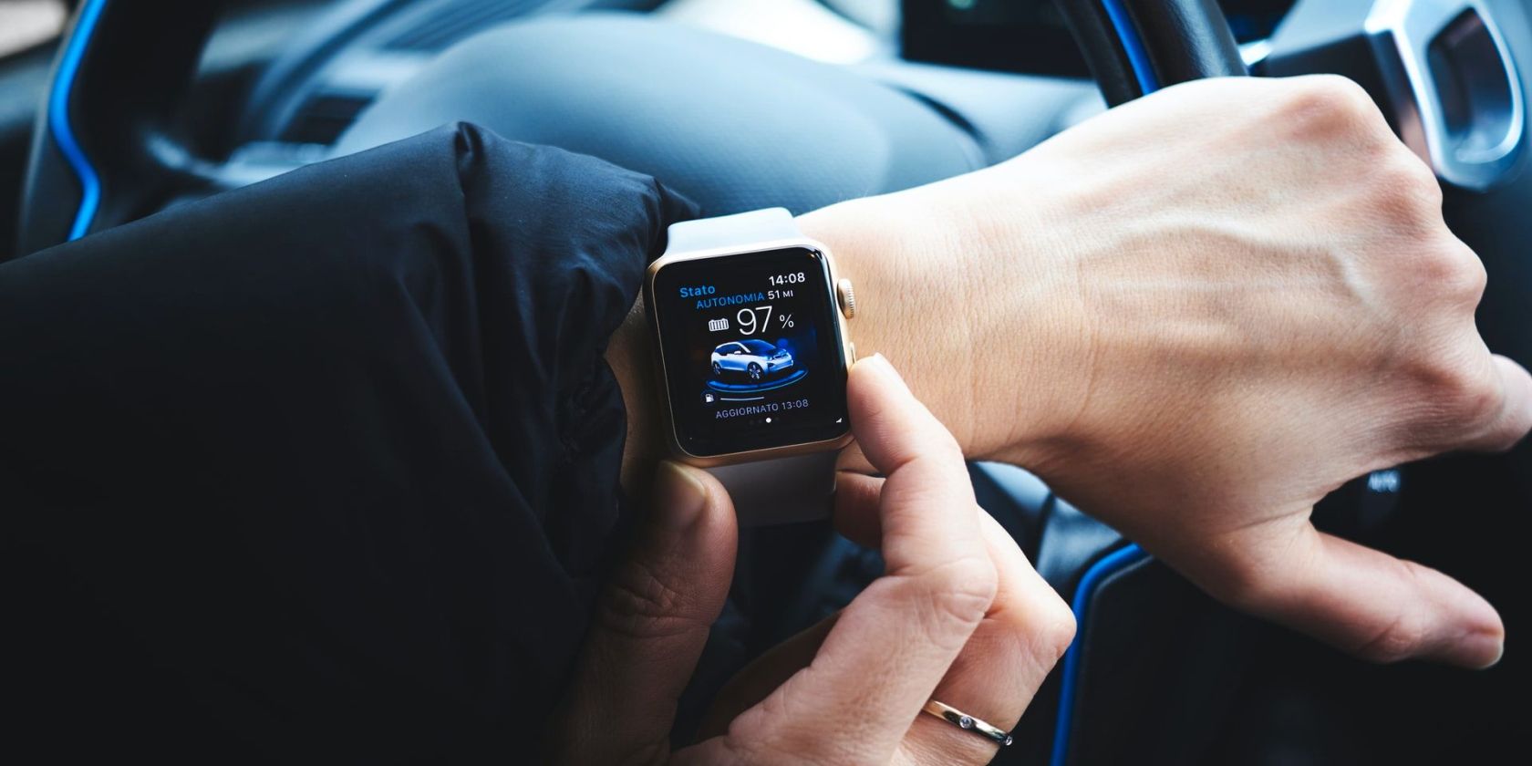 person-holding-apple-watch-in-car