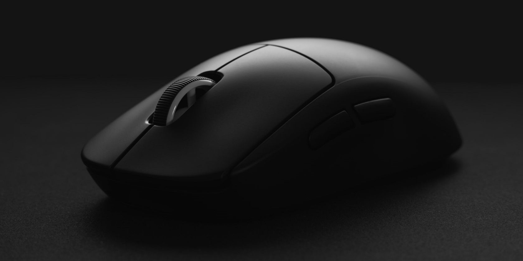  A black mouse against a black background