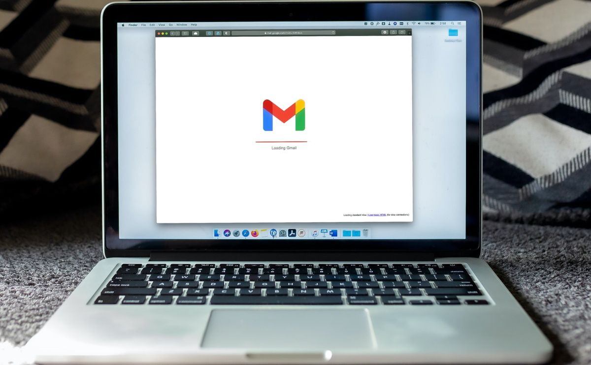 A laptop showing the Gmail loading page