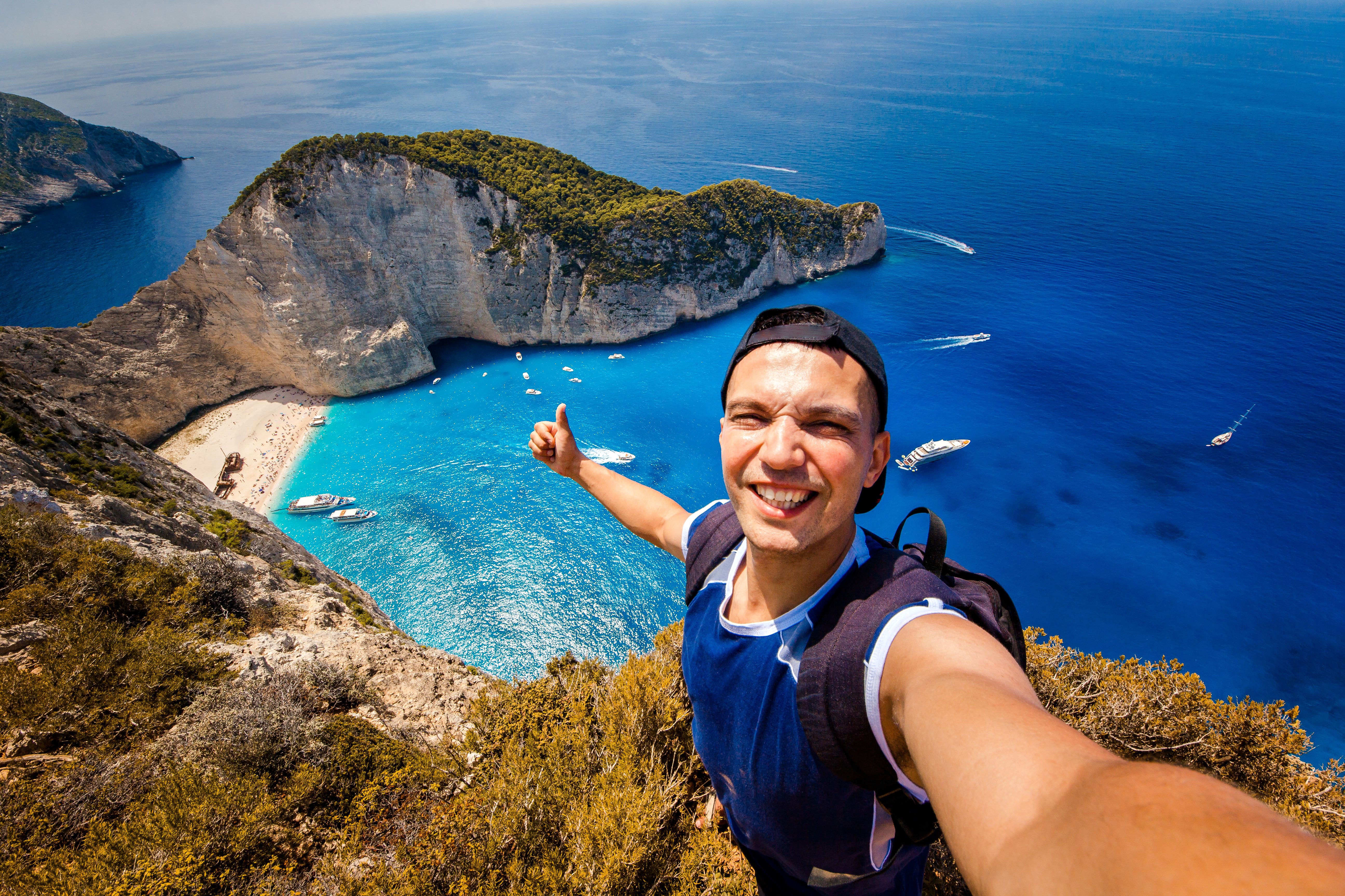 man taking selfie on tropical location