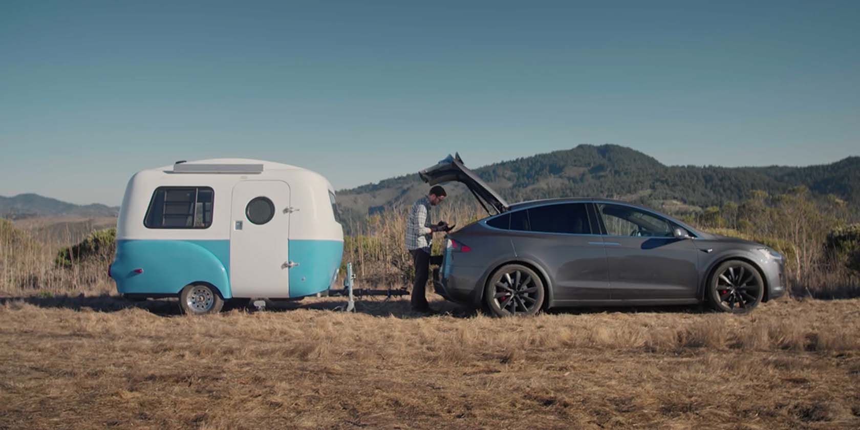 model x towing small camper image