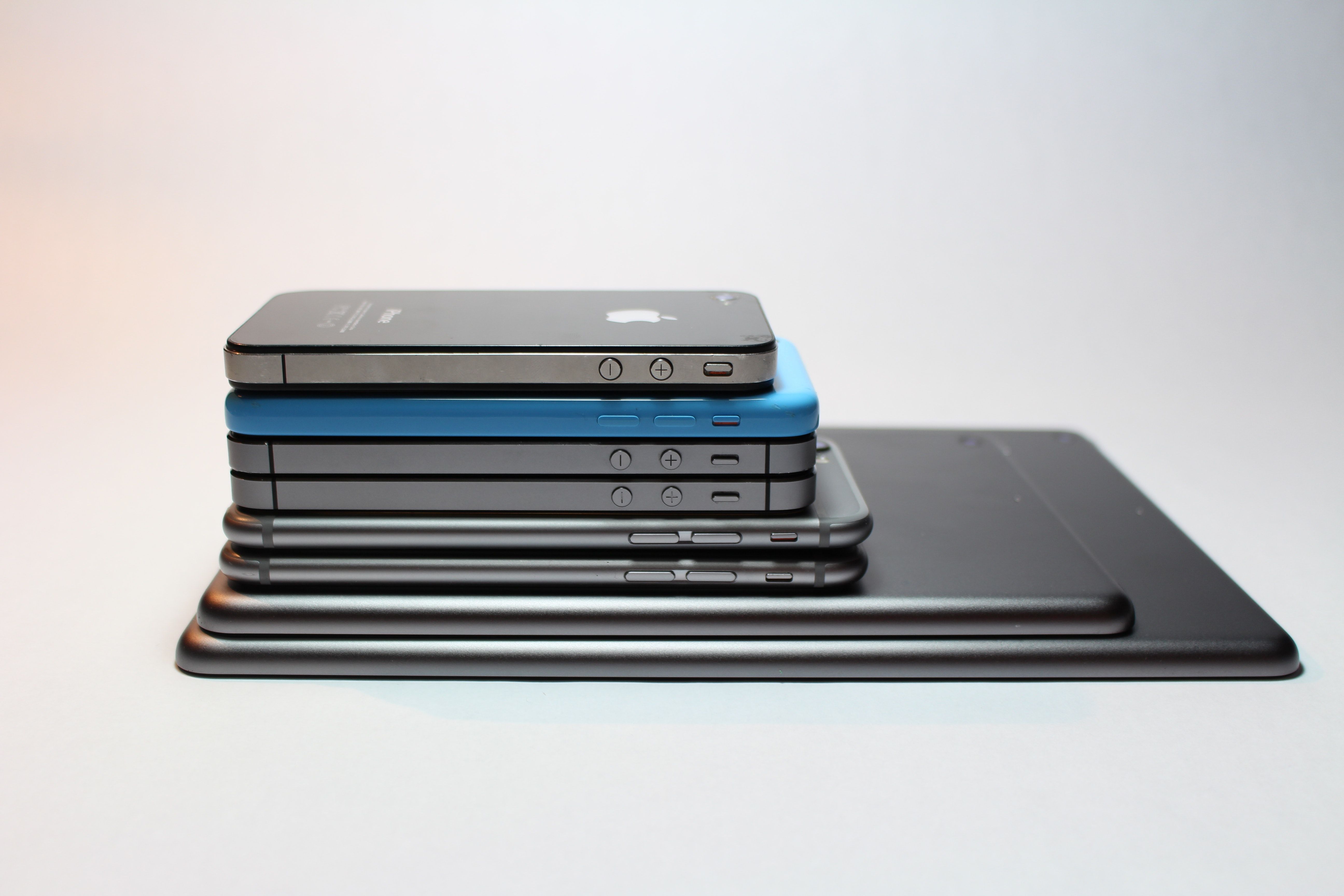 iPhones and iPads stacked together in different sizes