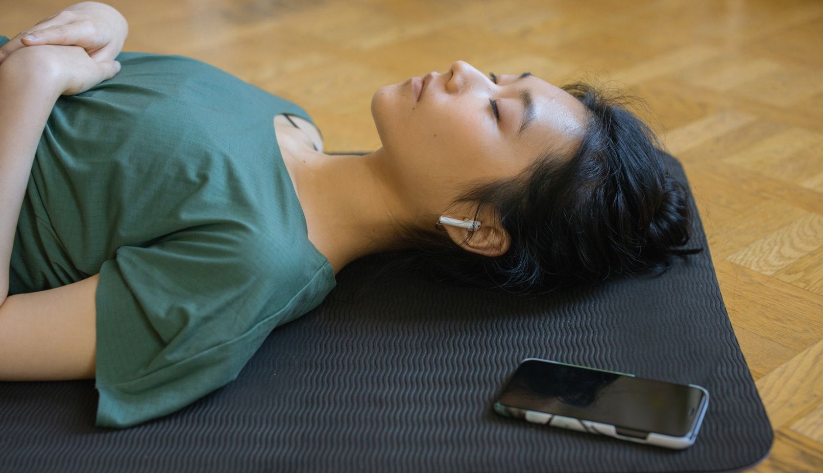 Woman meditating with headphones