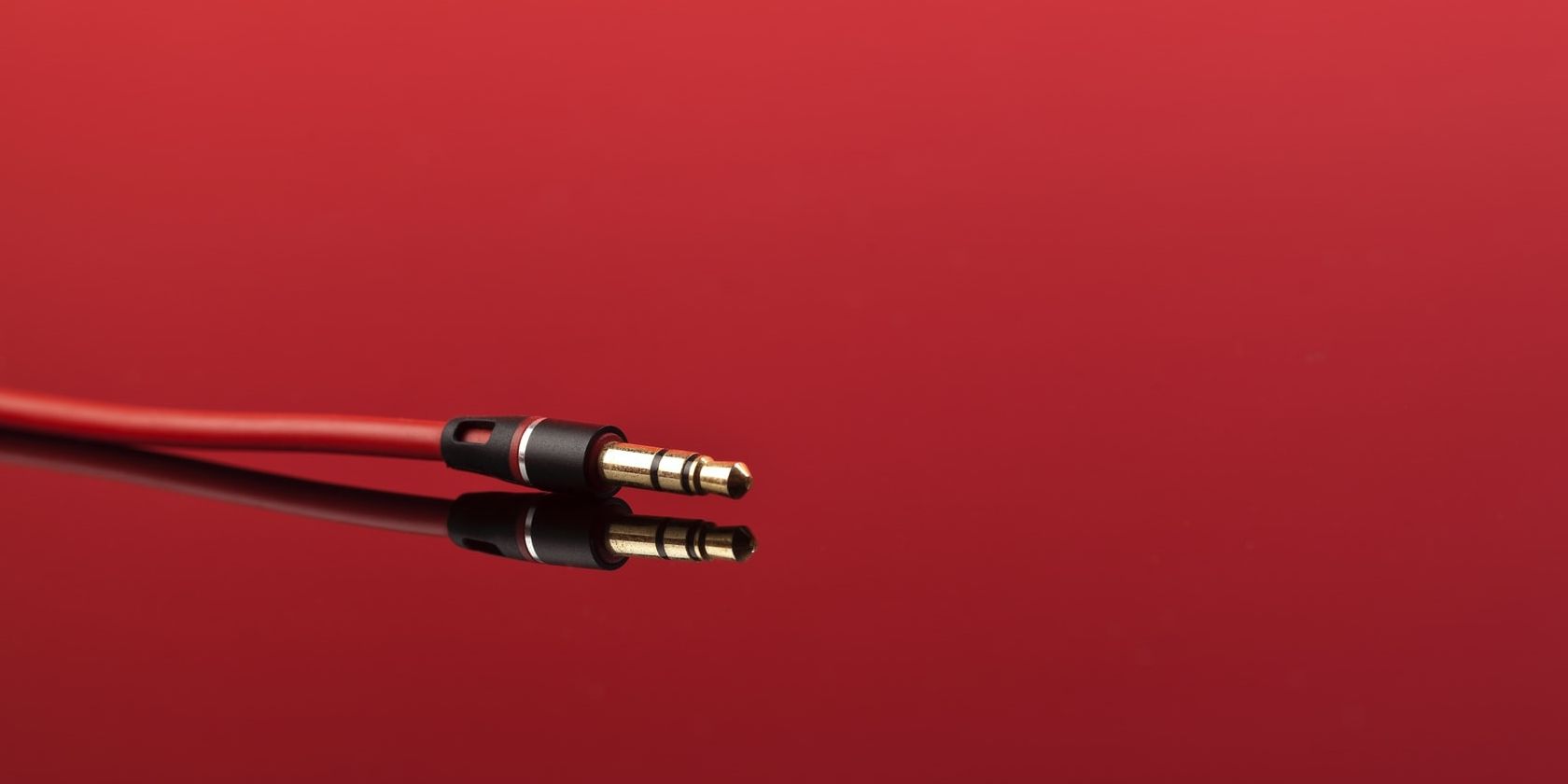 headphone jack with red background