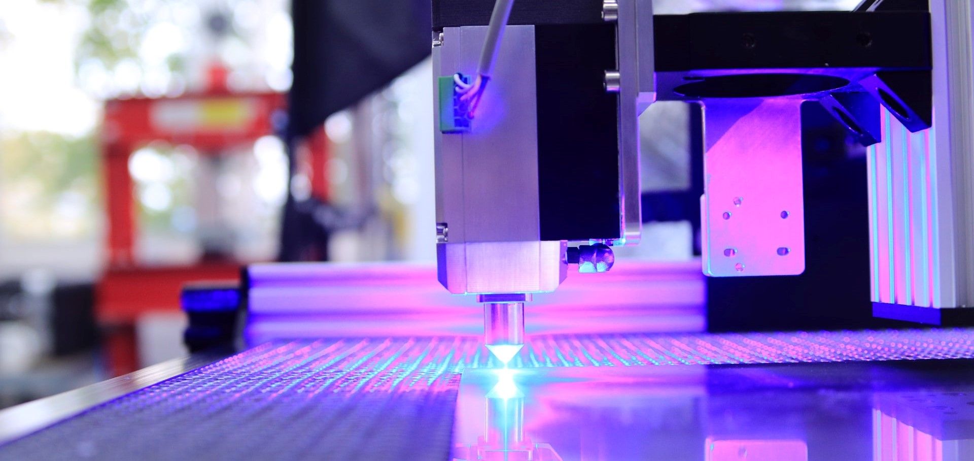 3d printing machine with purple and white led lights