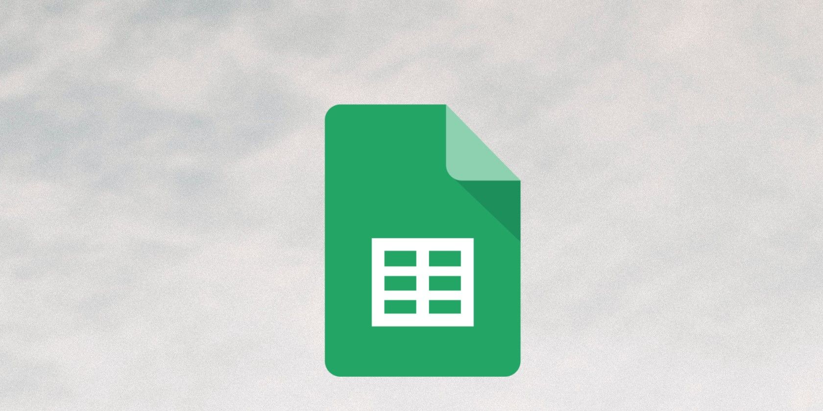 Google Sheets logo floating on a grey cloudy background