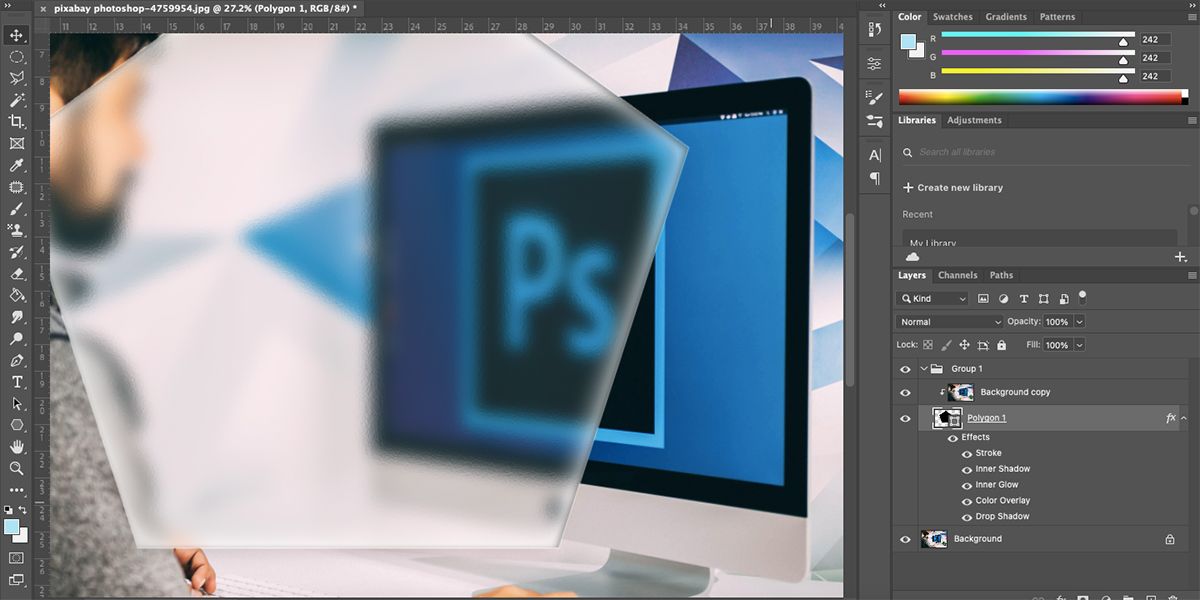 Photoshop logo on computer screen with a hexagon of dimpled glass texture over the top.