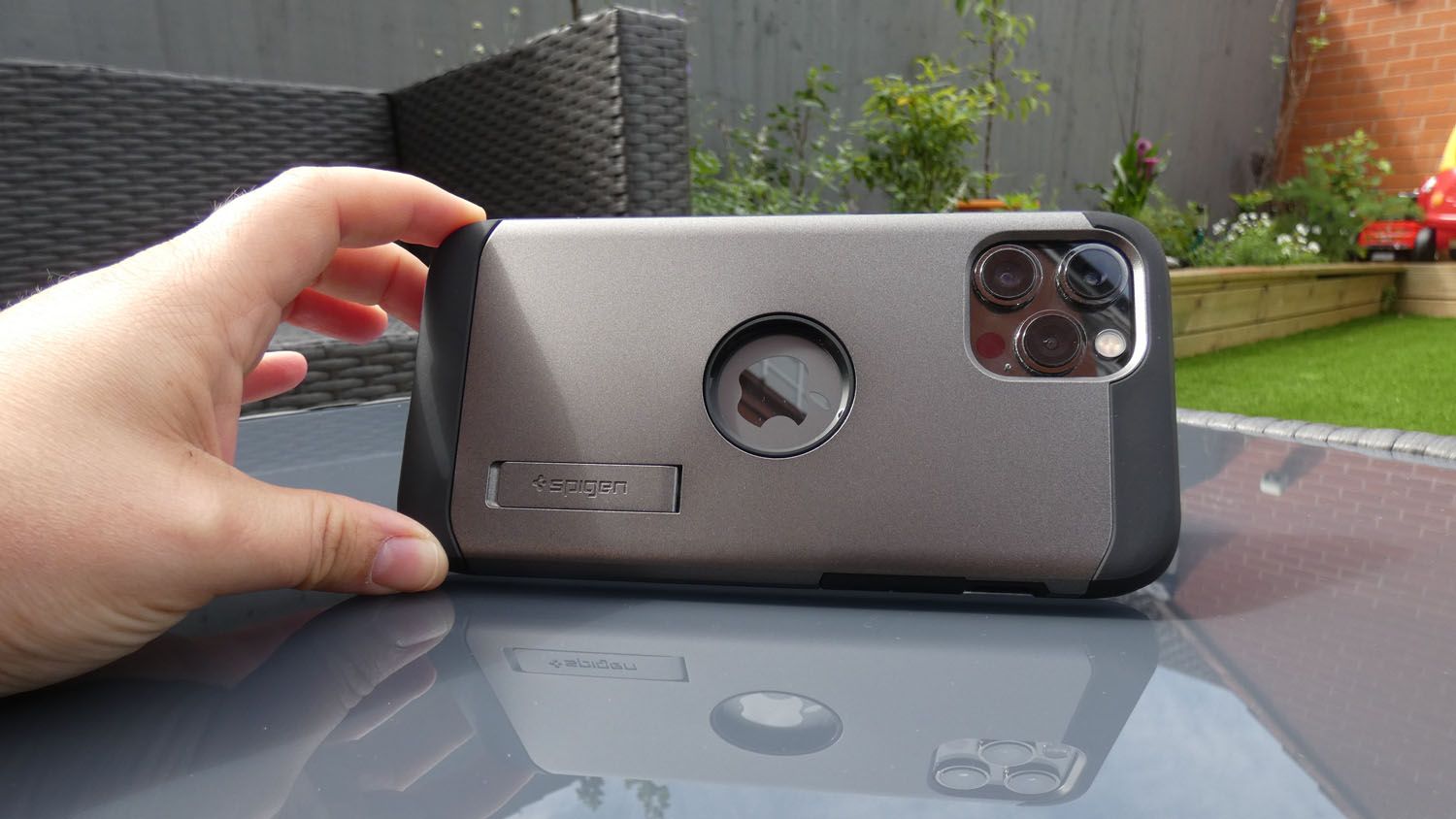 Spigen Tough Armor iPhone 12 Pro Max case with phone smaller