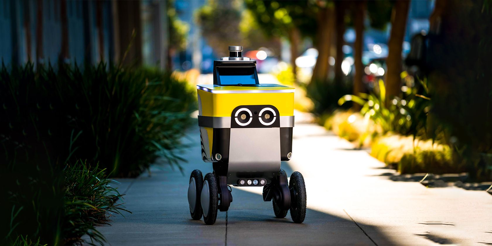 Uber Eats Serve Robot rolling on the sidewalk