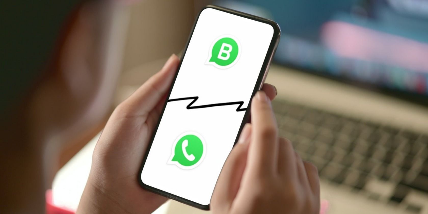 WhatsApp Business logo and WhatsApp logo on phone screen 