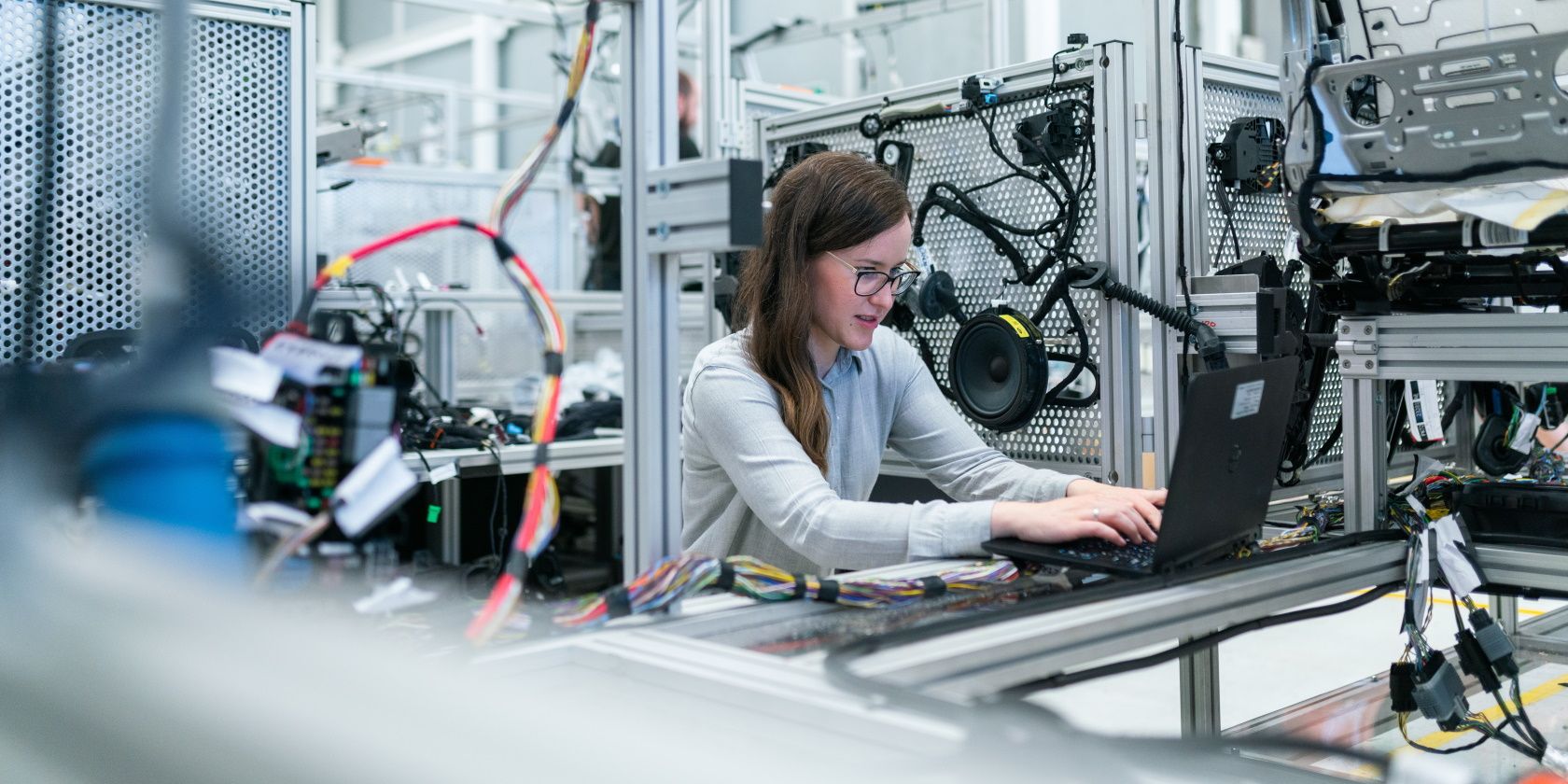 Woman Working in Manufacturing on Laptop