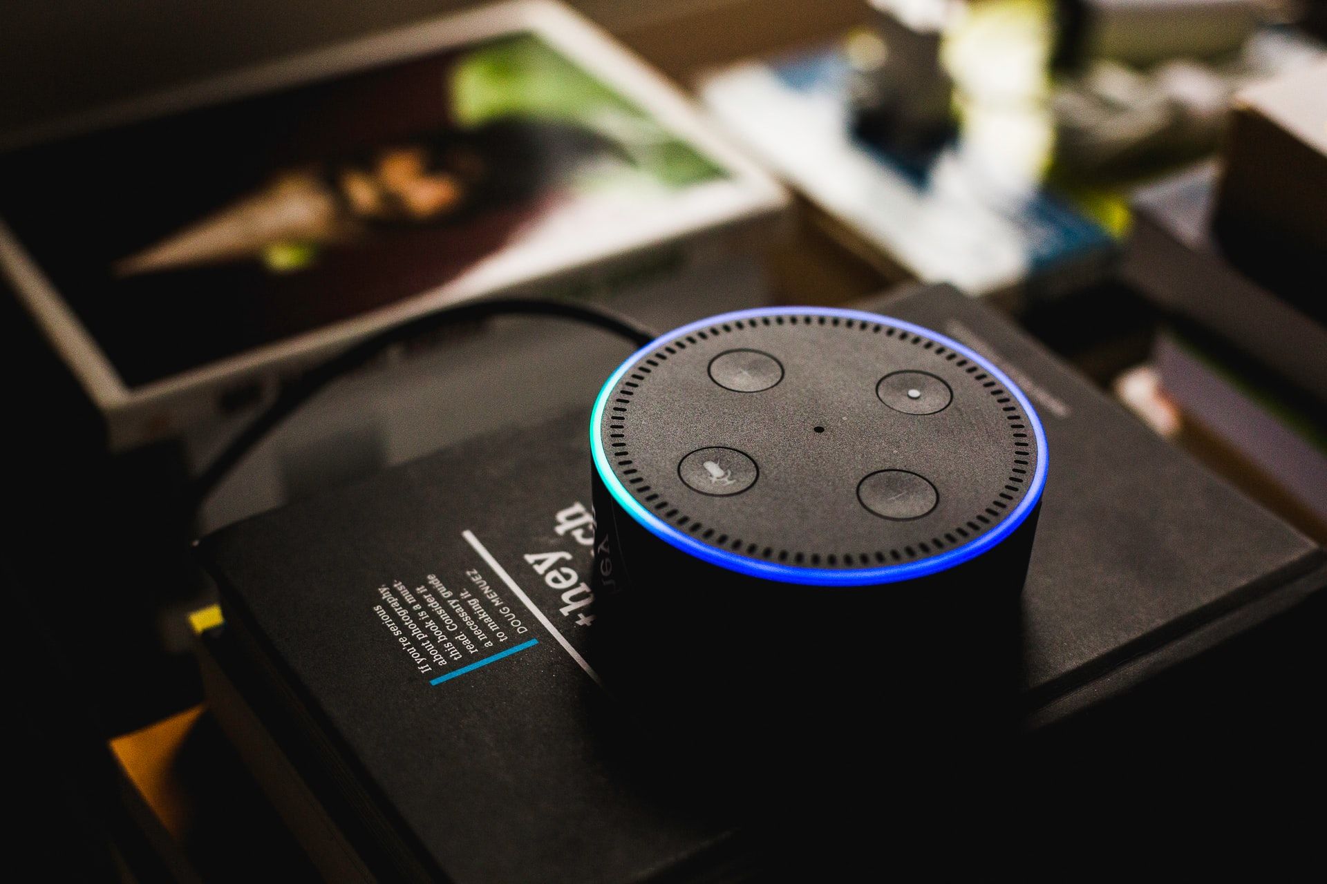 Image of an Echo Dot on a book