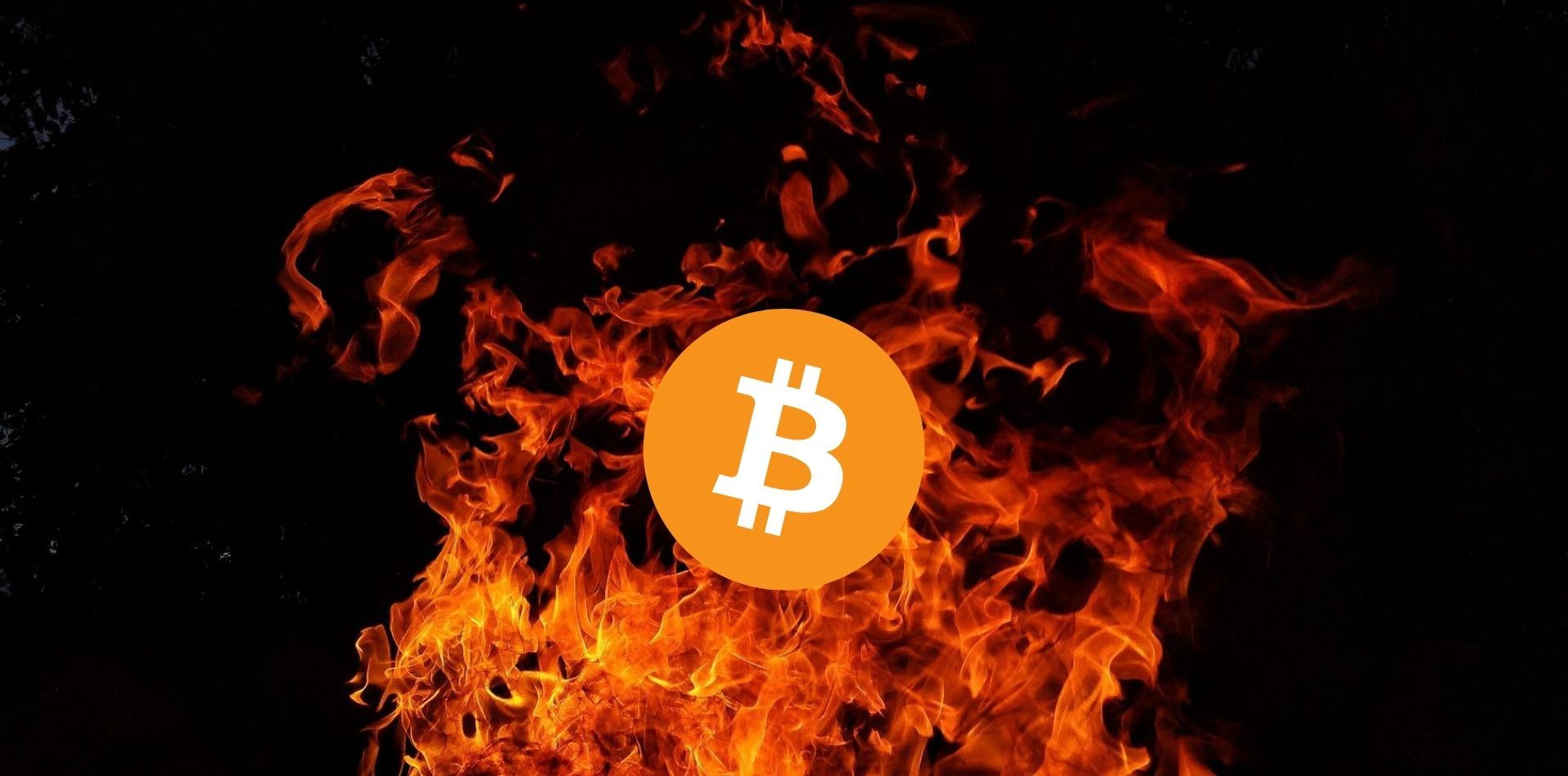 bitcoin logo in front of flames