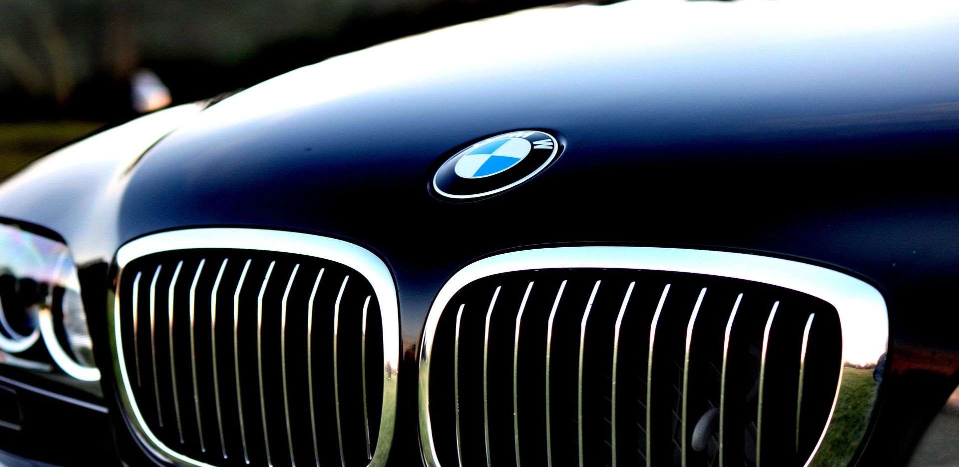 close up of black bmw bonnet and grill