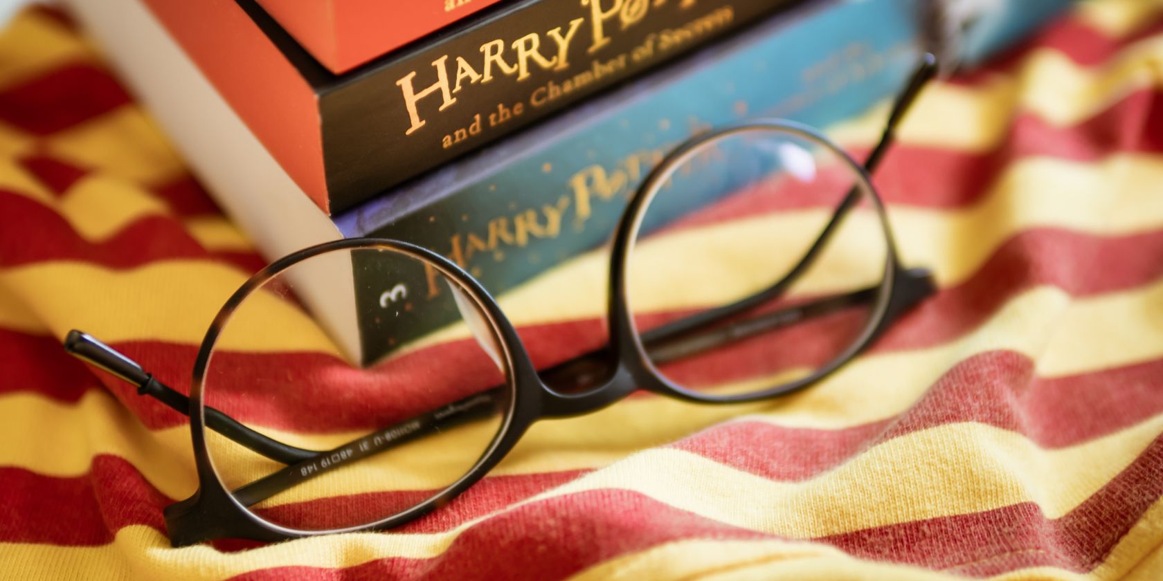glasses next to harry potter books