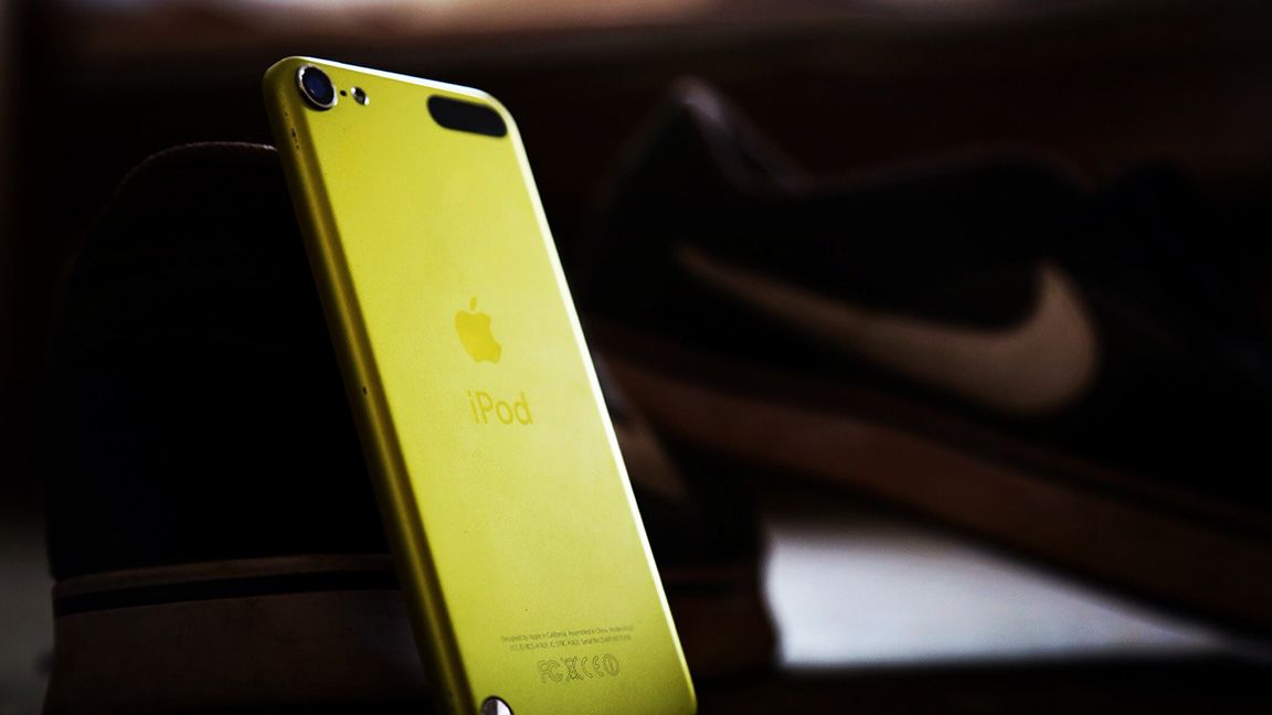 Yellow iPod on dark background