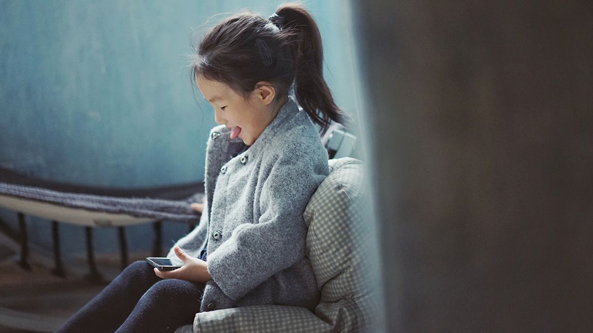 Young girl playing with iPod