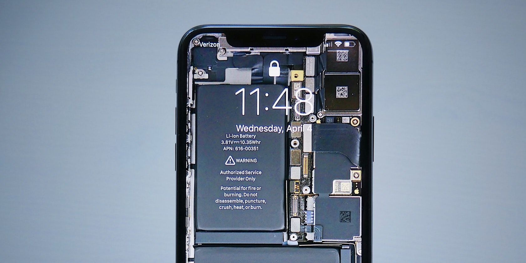 A photo of an iphone showing the internal hardware