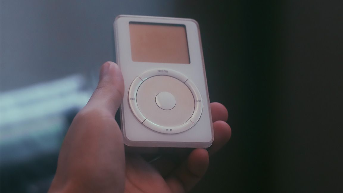 Holding a first-gen iPod