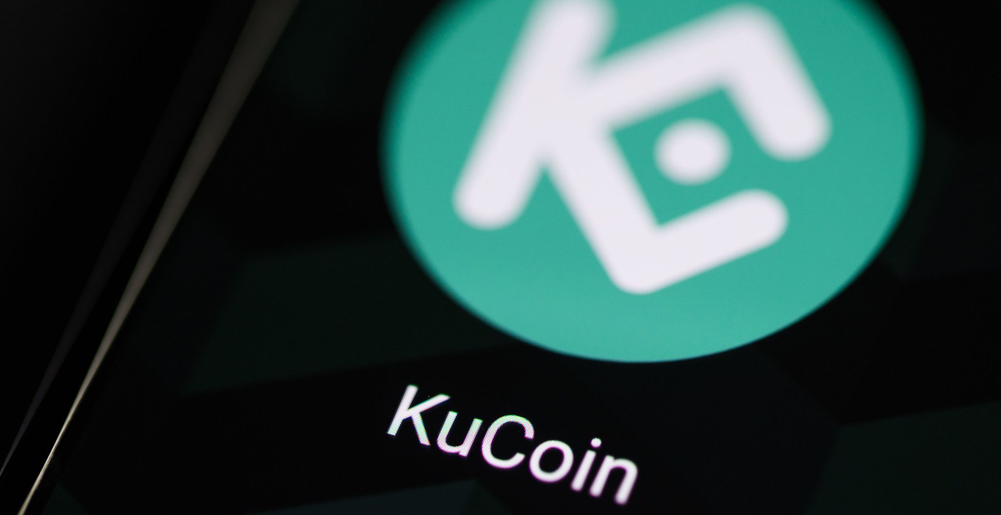 kucoin logo on smartphone screen