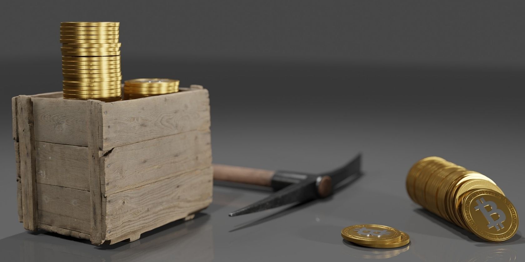 mining pick axe next to gold bitcoins 
