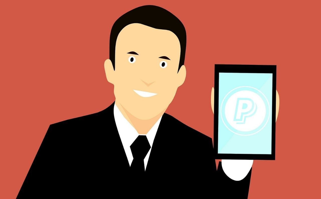 A man and an illustration of the PayPal logo