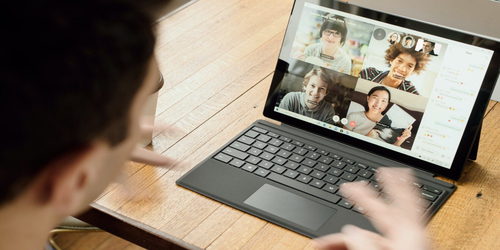 man on group video call with 4 participants on desktop screen