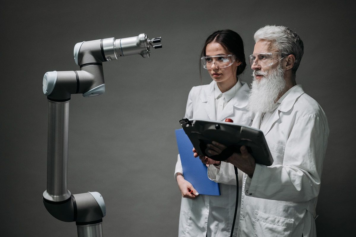 scientists examine a robot