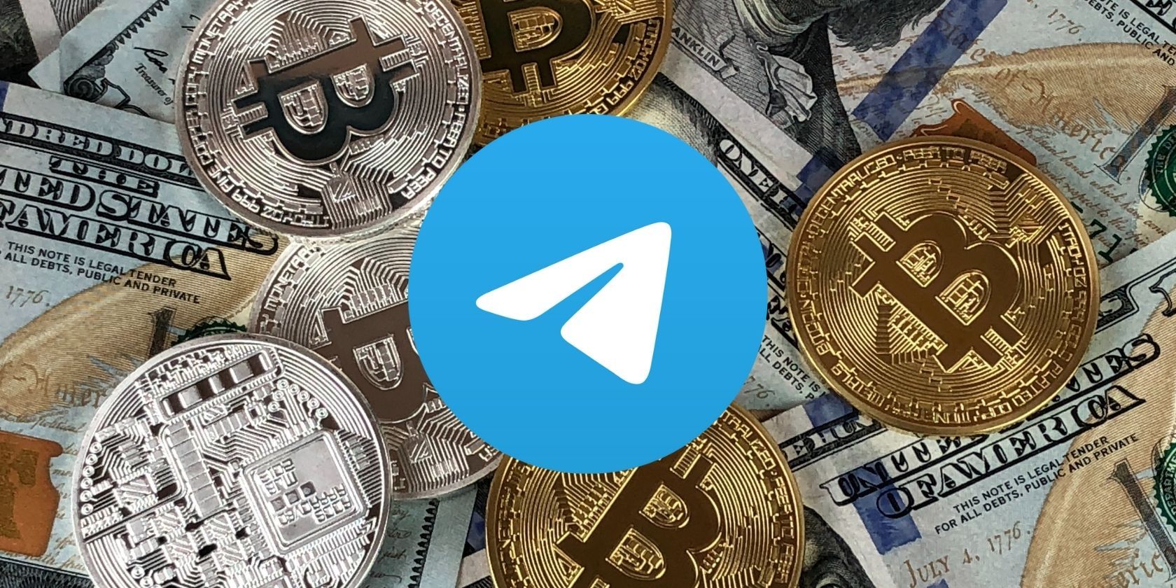 telegram logo in front of dollar bills and crypto coins