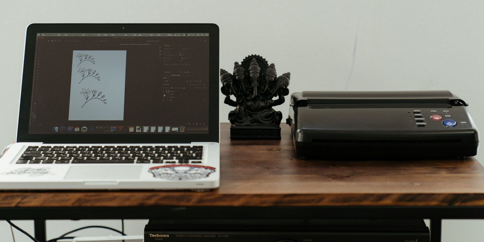 Printer beside a laptop