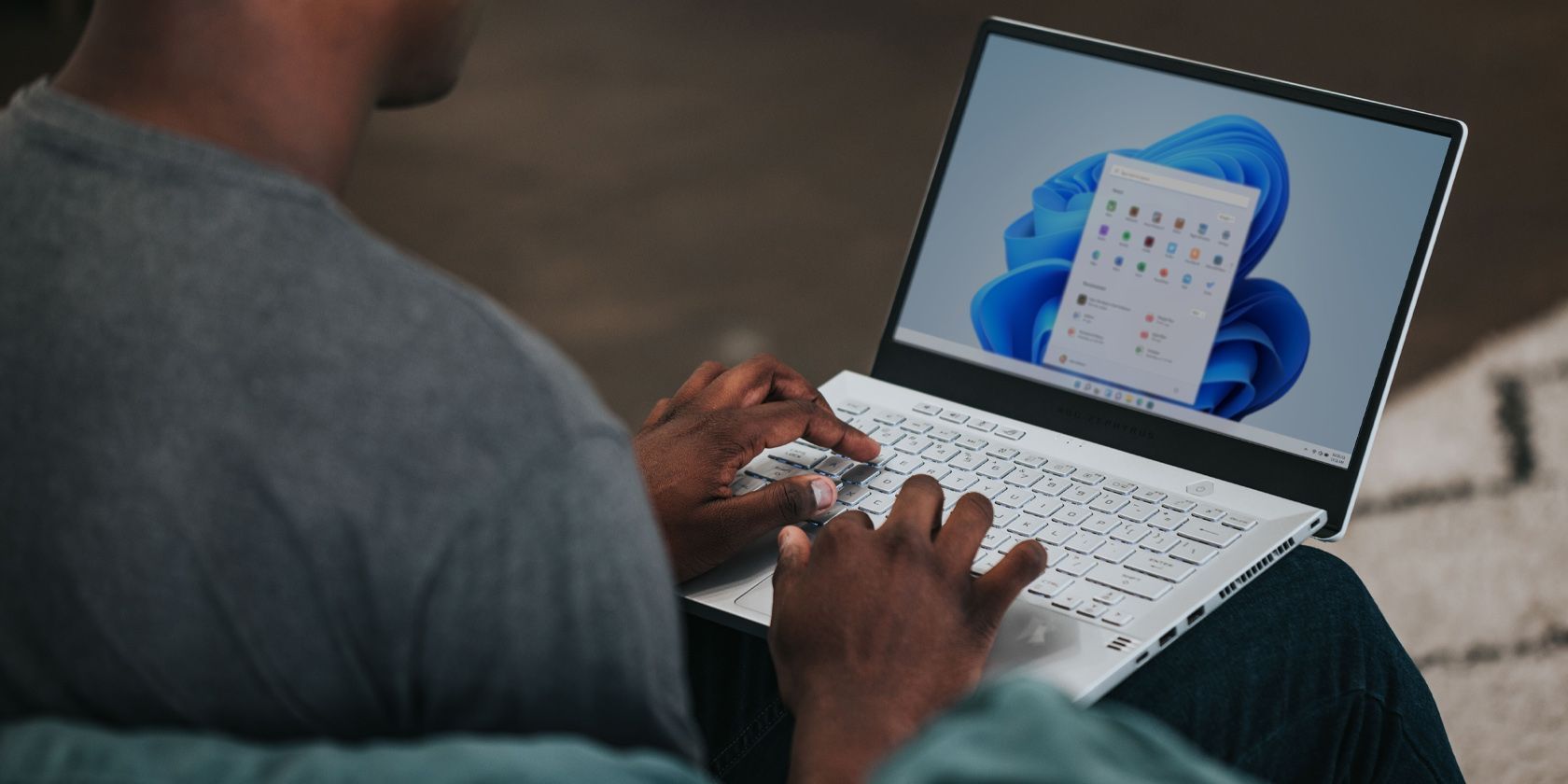 A Man Using Windows 11 in a Laptop
