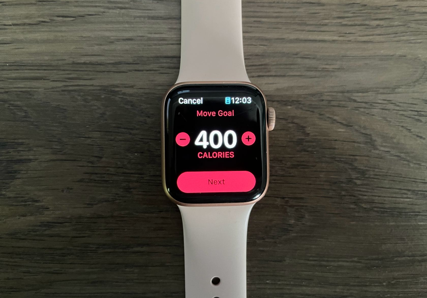 A watch displaying a movement goal adjustment menu