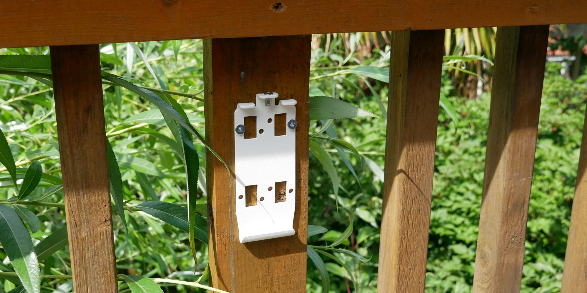 IQAir AirVisual Outdoor Mounting Plate Mounted to Wooden Post