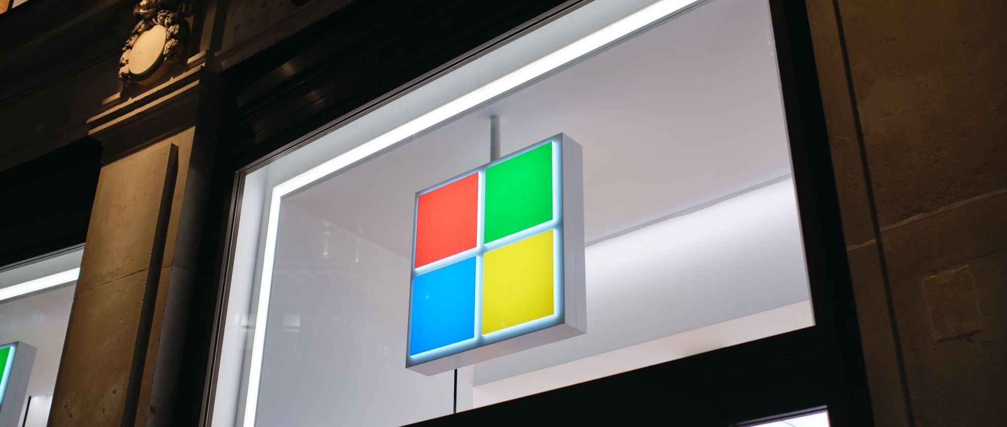 Microsoft logo in lights on a window