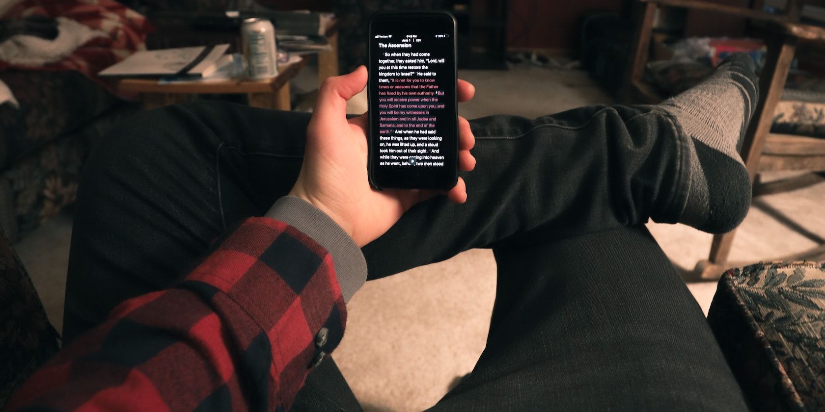 Person reading on Phone Featured