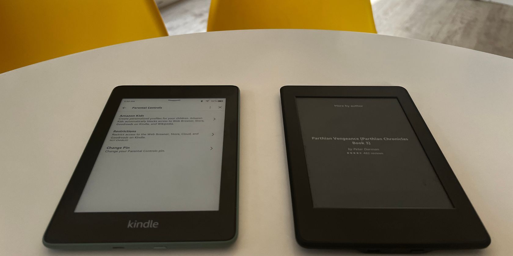 Two Kindle Paperwhite Devices on Table