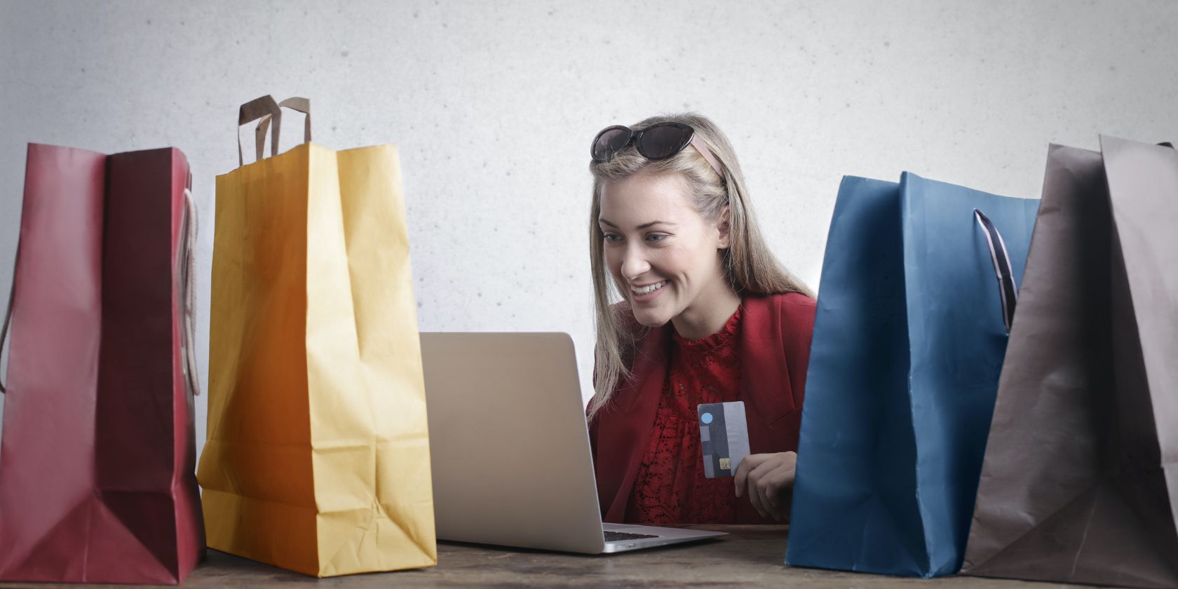 A happy woman shopping online